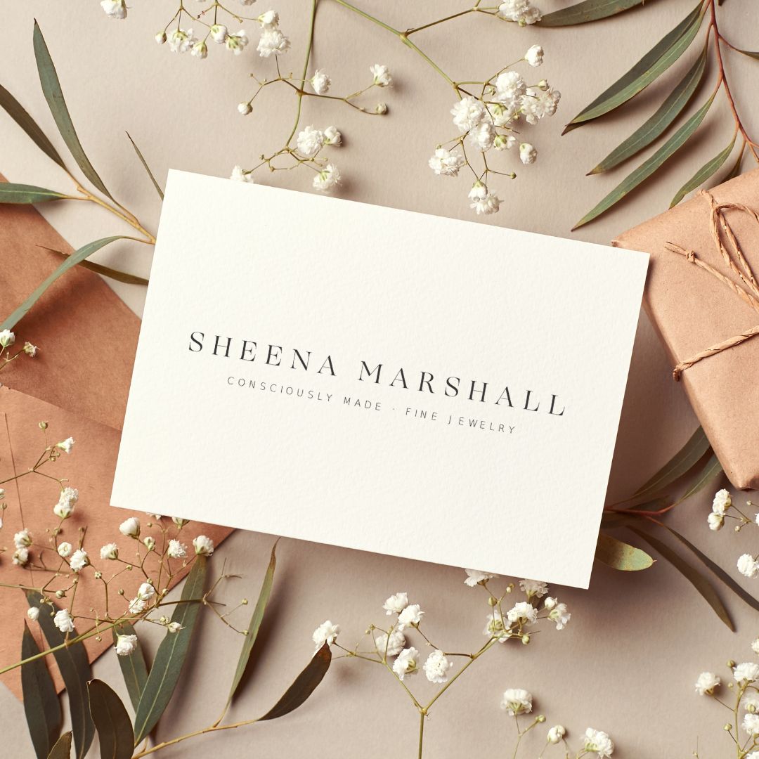 A Sheena Marshall digital gift card displayed on a neutral background with delicate floral accents.
