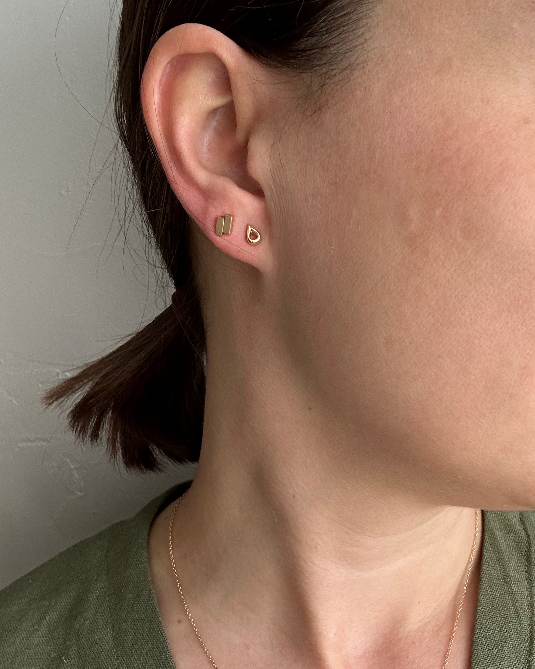 perfectly imperfect jewelry, non traditional fine jewelry teardrop studs in solid recycled 14k gold on model