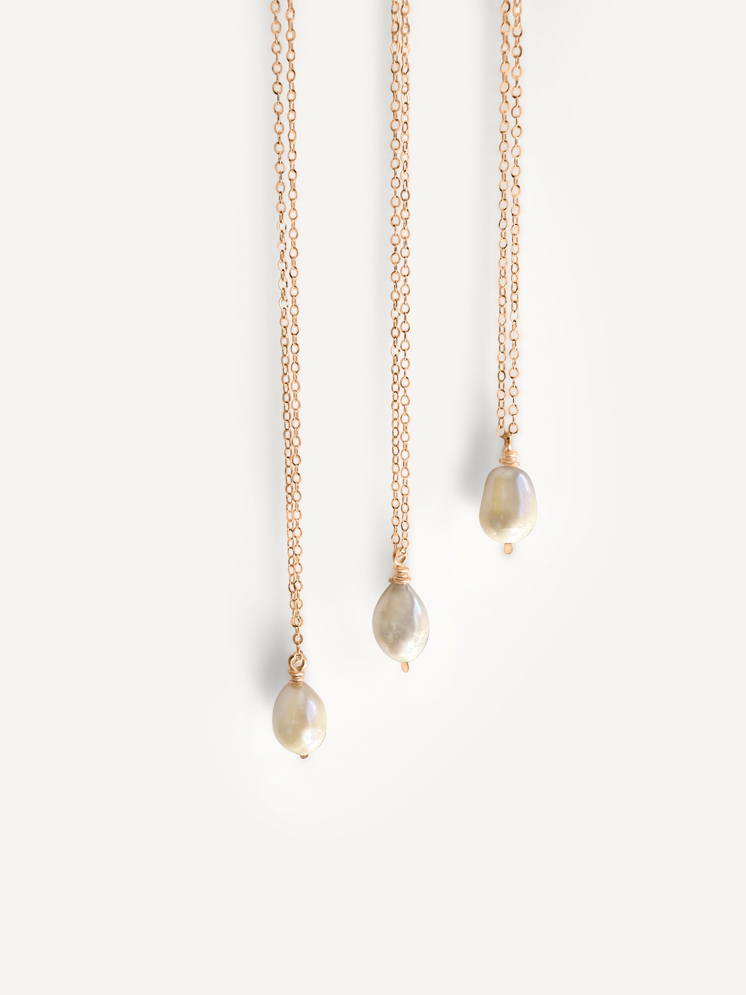 Handcrafted Baroque Pearl Necklace by Sheena Marshall Jewelry, featuring a unique Baroque pearl approximately 9-13mm, set on a 14k gold-filled chain with a hand-hammered, twisted bail, showcasing its organic beauty and artisanal craftsmanship.
