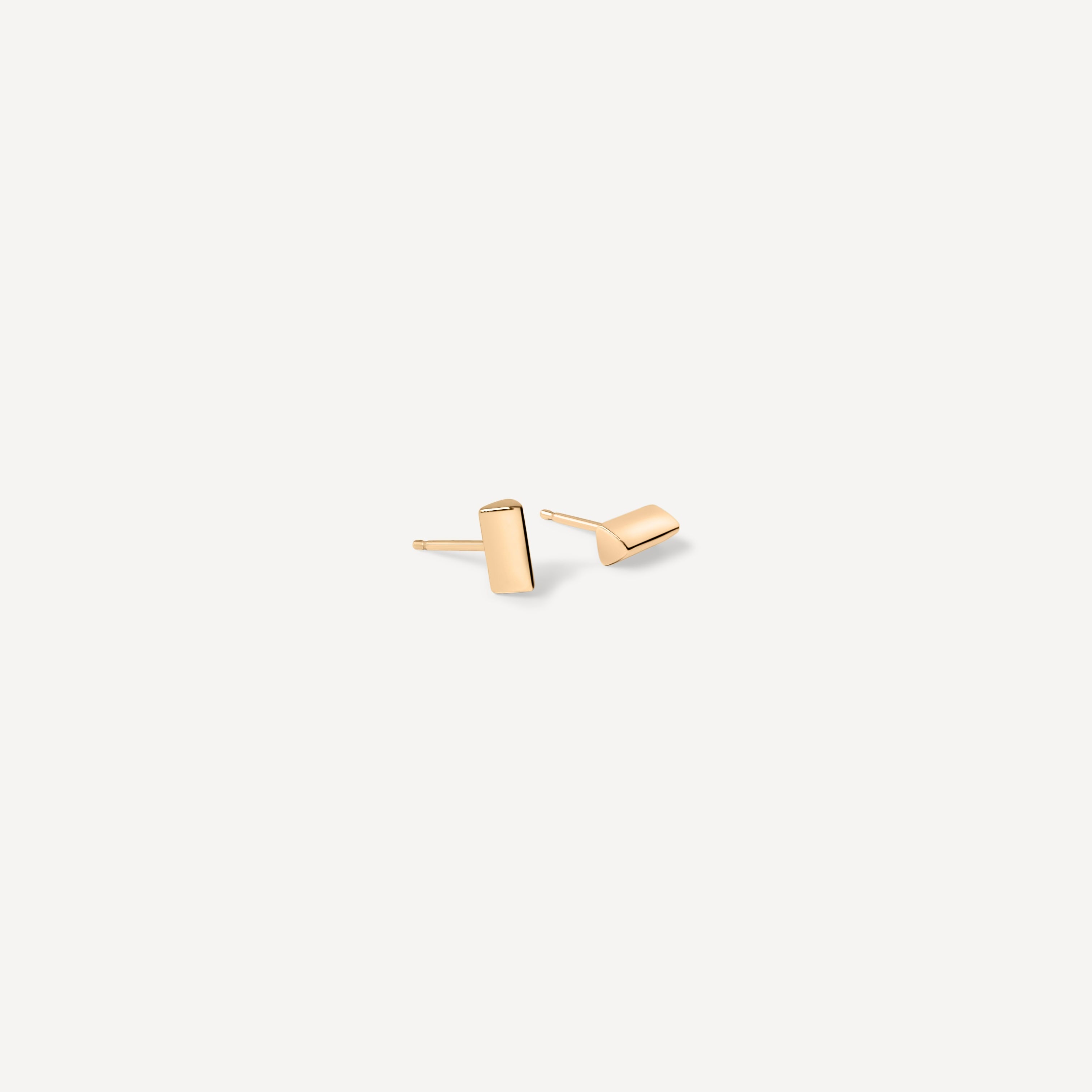 Contemporary knife edge gold studs with precise angular design, handcrafted for minimalist jewelry collectors seeking modern essentials