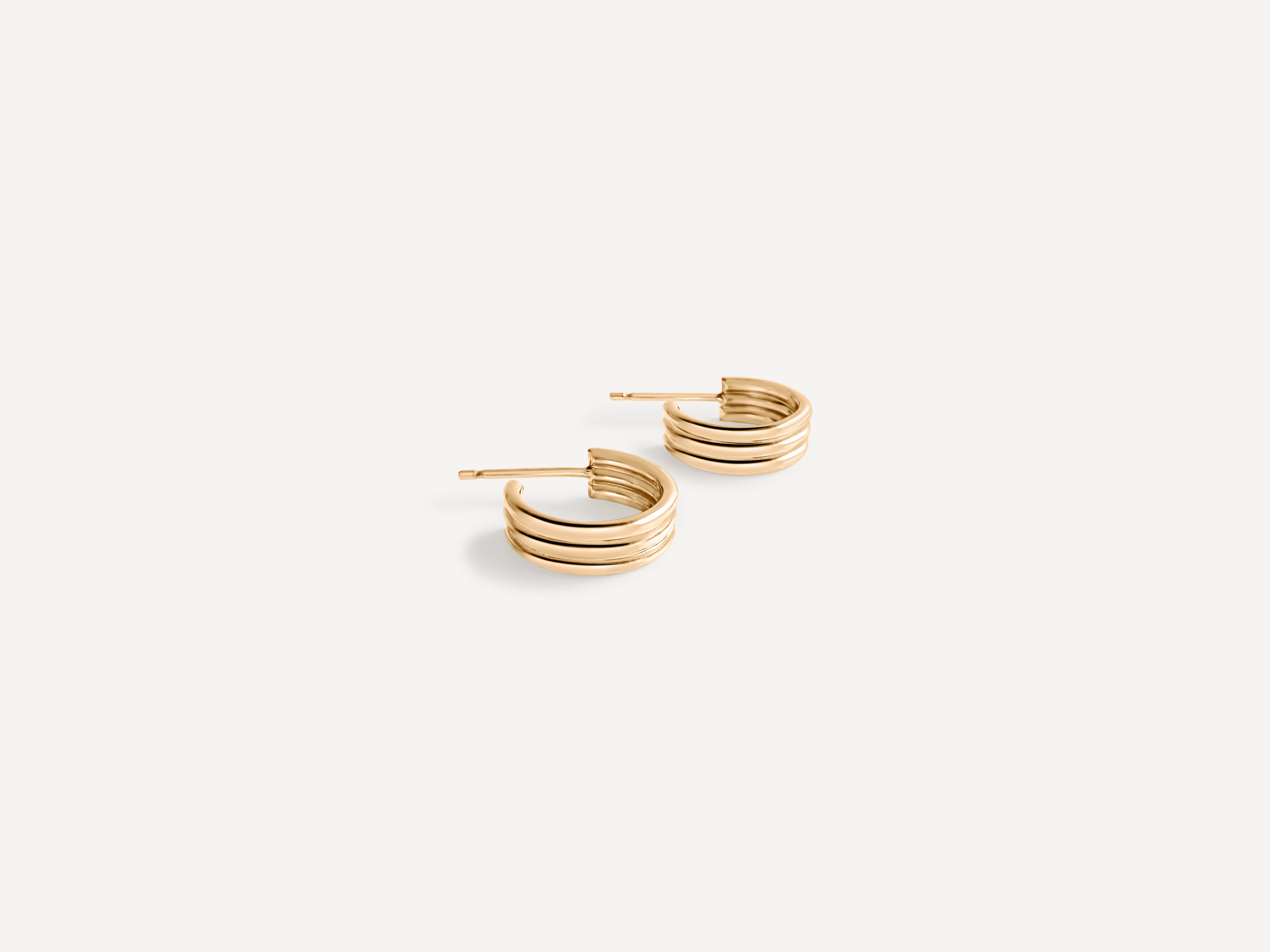 Triple Hoop Earrings displayed on a clean background, highlighting their gold-filled texture.
