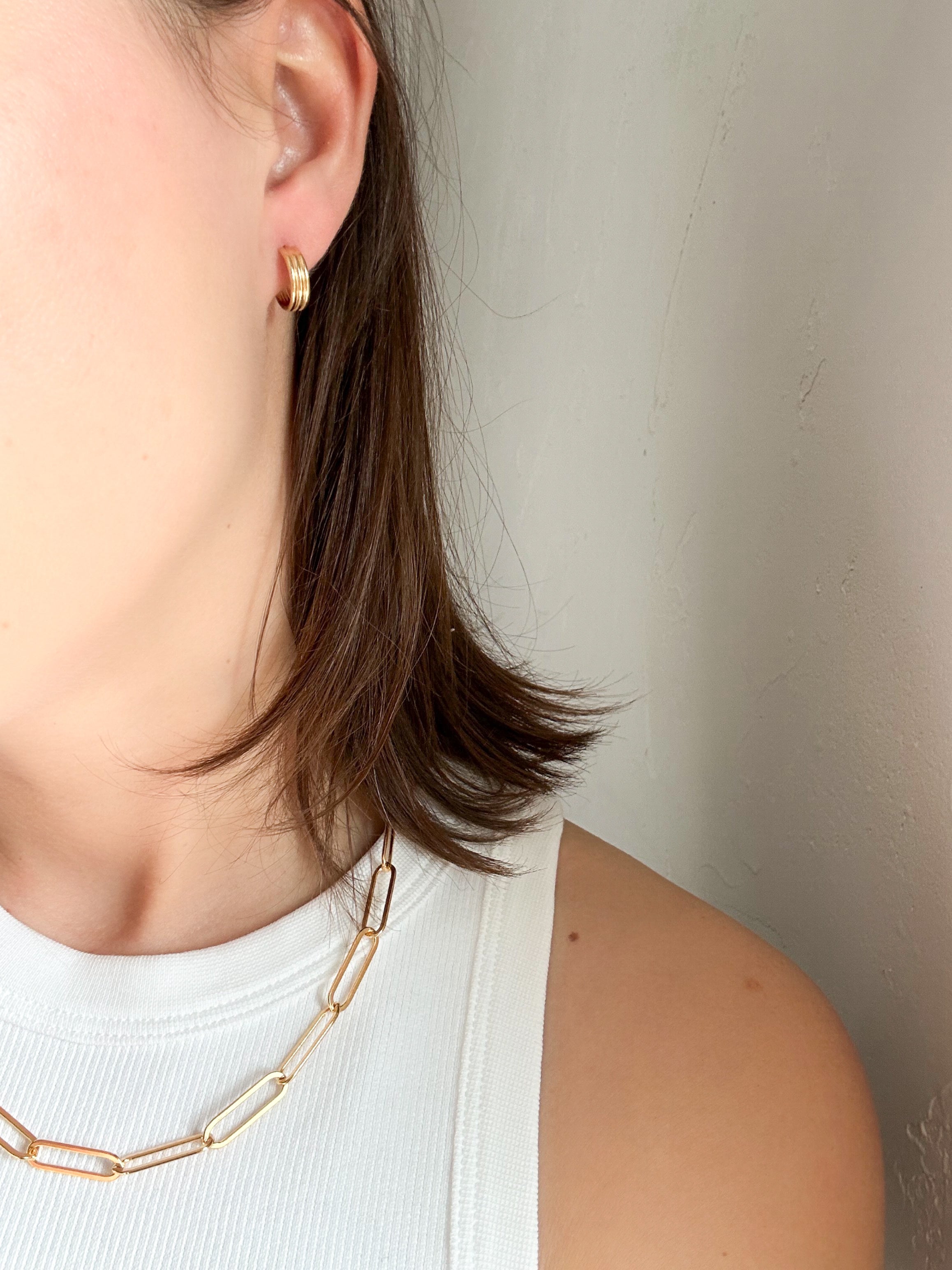 Woman wearing Triple Hoop Earrings in gold fill, a perfect accessory for day-to-night wear.