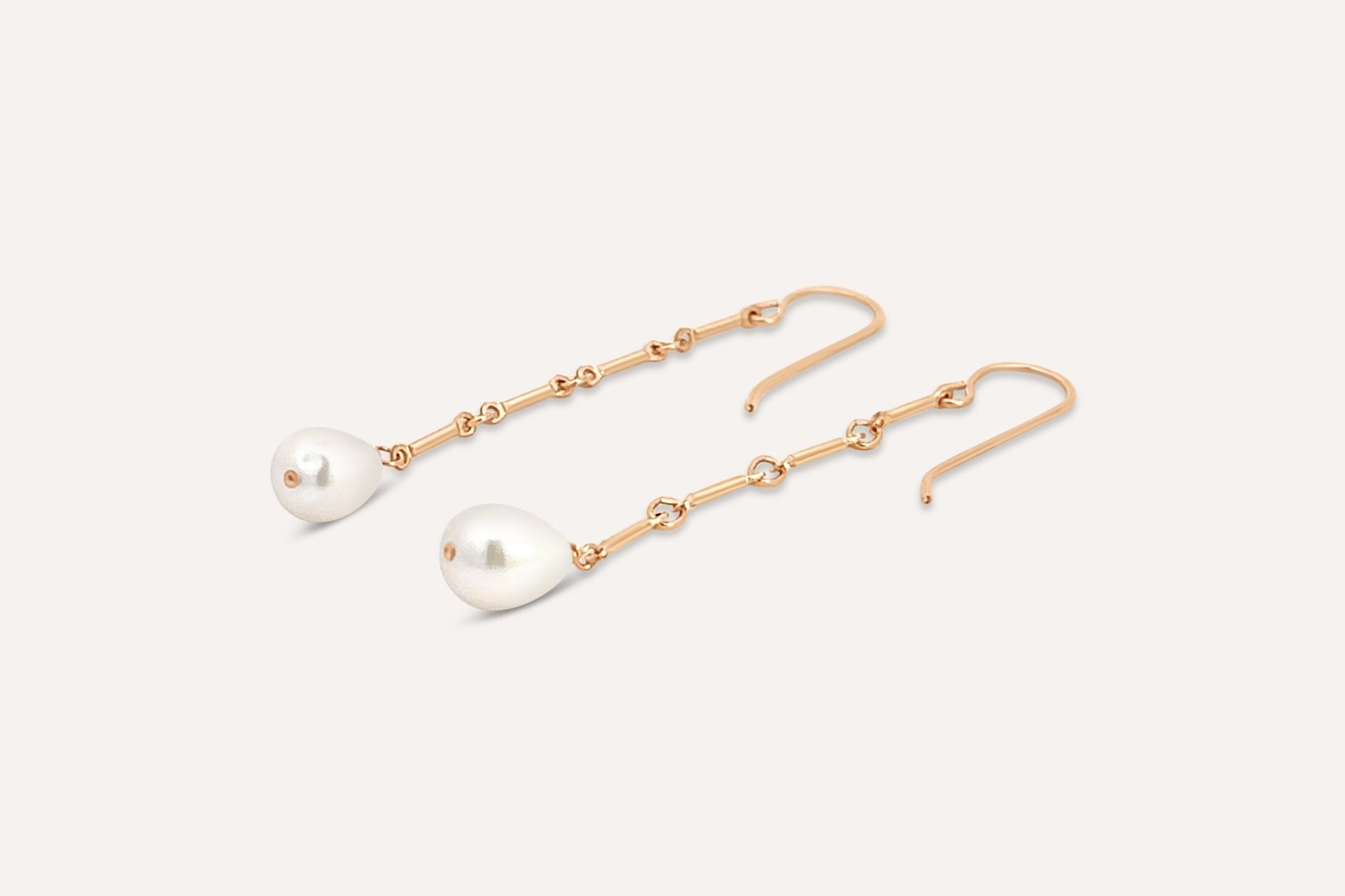 Gold-filled Florentine Earrings with freshwater pearls on a neutral background.