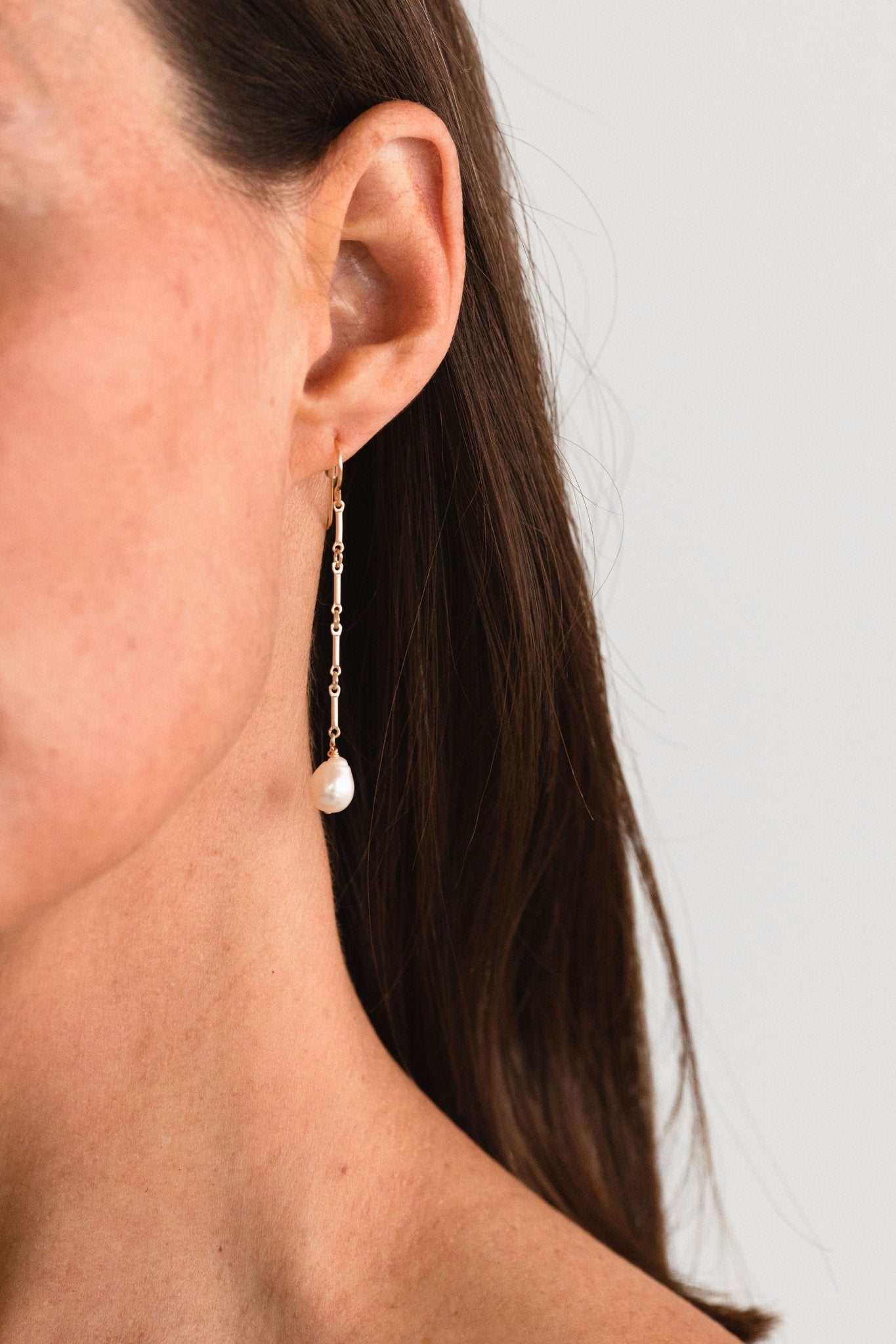 Side profile showcasing the elegant drop of the Florentine Earrings.