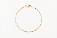 Handmade gold-filled link chain bracelet by Sheena Marshall Jewelry, featuring unique elongated links with a secure clasp, perfect for layering and everyday elegance