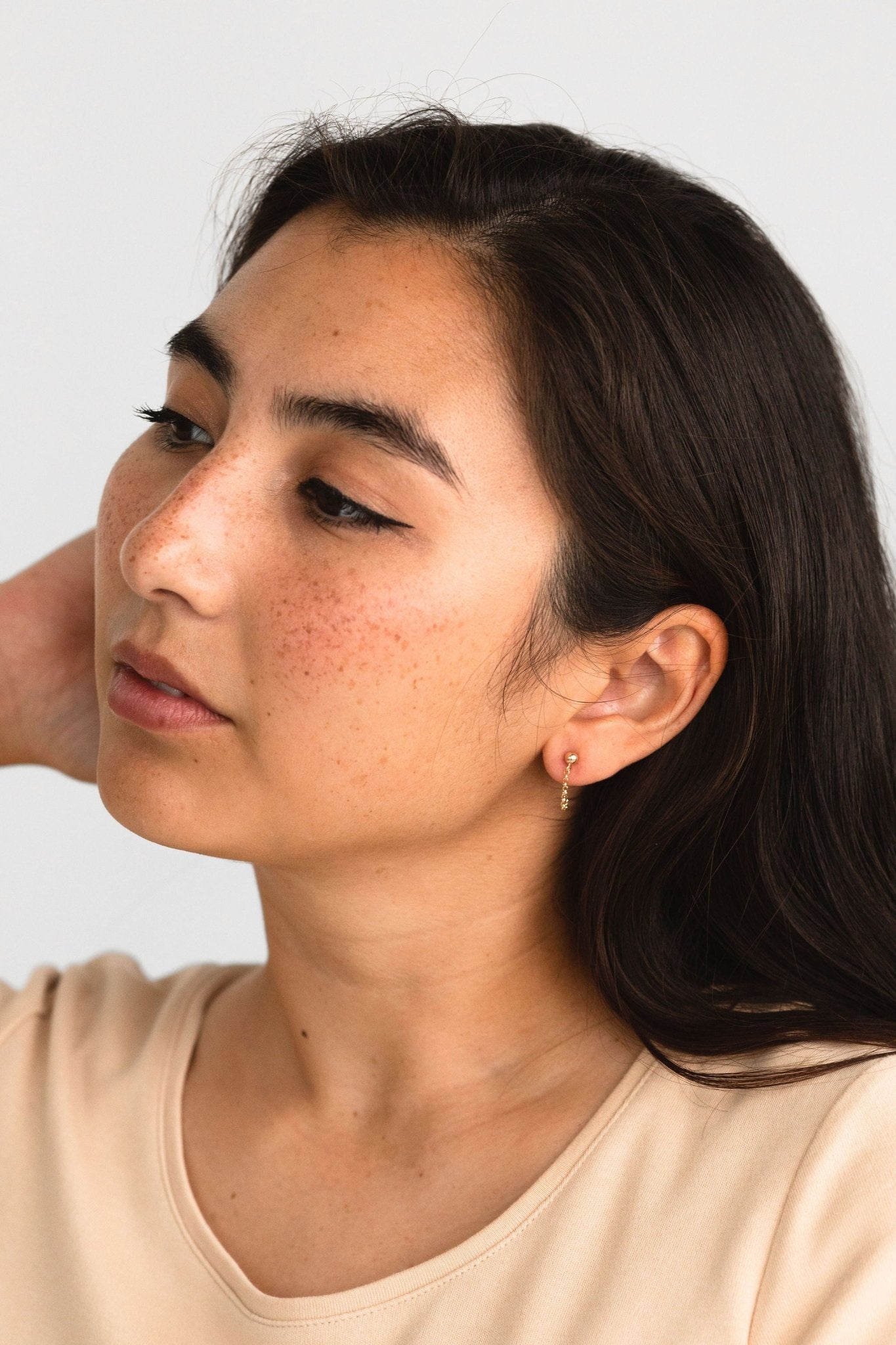 Close-up of the Hudson Earrings in gold fill worn by a model, highlighting their craftsmanship and linked detail, Chain Loop Earrings • 14k gold fill - Dangle Earrings - Edgy - Bridesmaids - Minimalist Gift for Her - Drop Studs - Dainty Posts, Sheena Marshall Jewelry, Denver Colorado