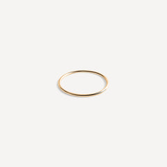 1mm thin gold stacking band by Sheena Marshall Jewelry, handcrafted in 14k recycled gold, perfect for minimalist style and sustainable everyday wear