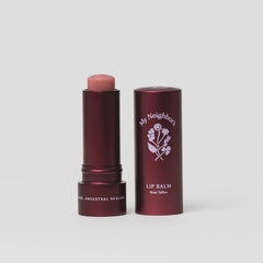 Tallow Lip balm with red packaging and visible brand logo on a light gray background