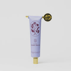 Tallow Hand balm tube with floral design and gold cap on a white background