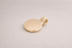 Circle Pendant on linen background_Sheena Marshall Jewelry_Solid 14k gold