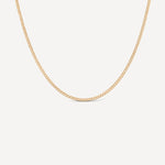 14k gold fill curb chain necklace on a light gray background
