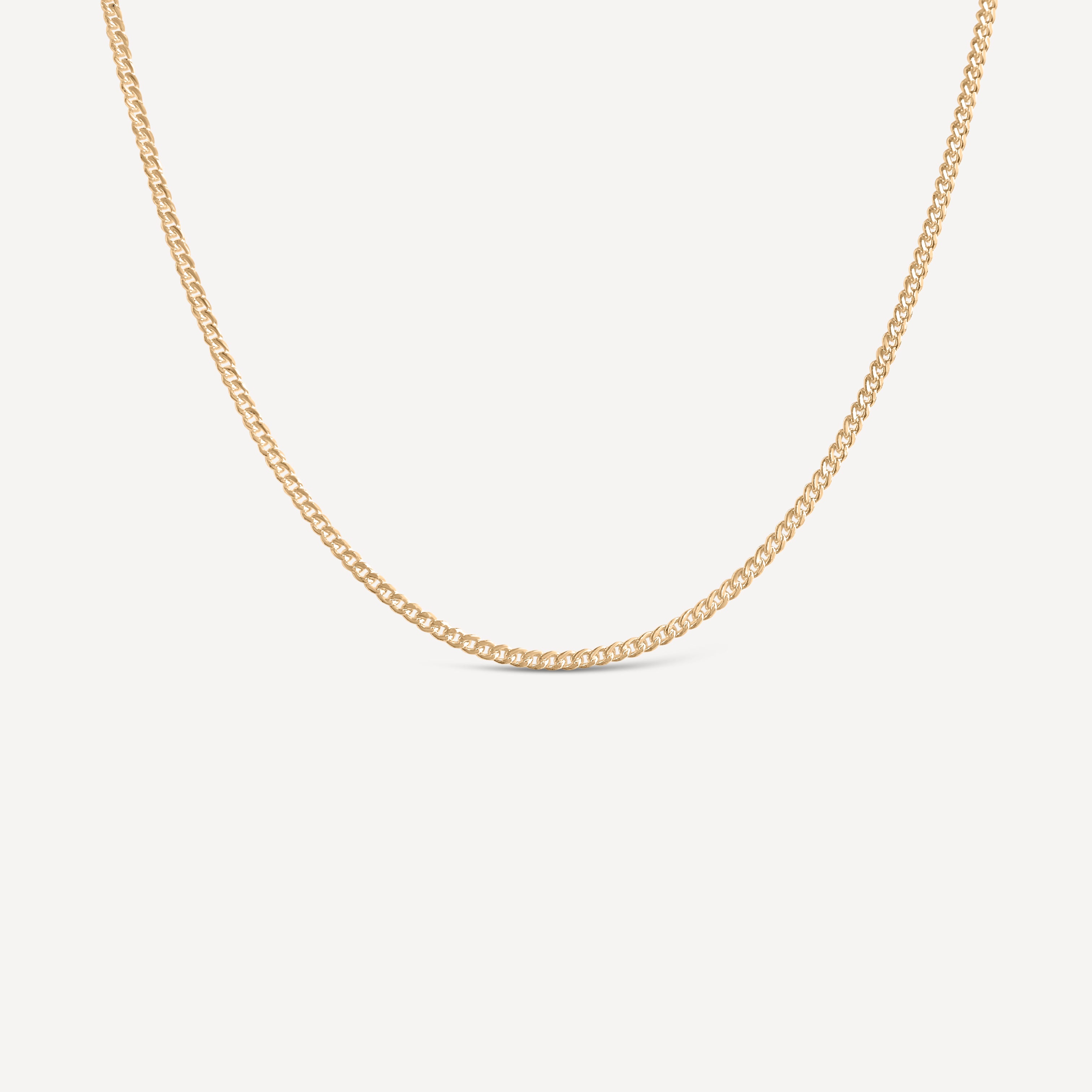 14k gold fill curb chain necklace on a light gray background