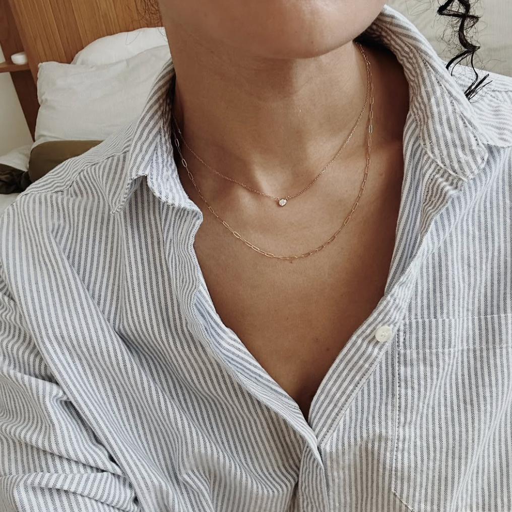 Layering 14k gold fill necklace with diamond pendant necklace on model