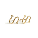 Gold spiral earrings with small diamonds on a white background