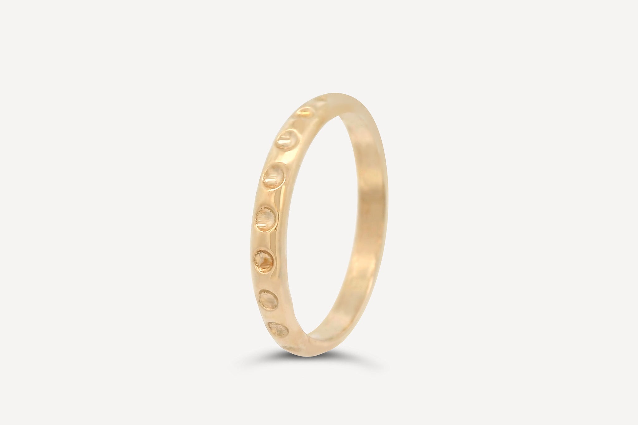 Dot Band ring handcrafted in recycled brass by Sheena Marshall, featuring a sleek and solid 3mm band design.