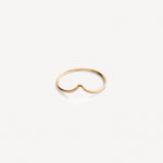 Gold-filled Emilie Arch Ring flat lay against neutral background.