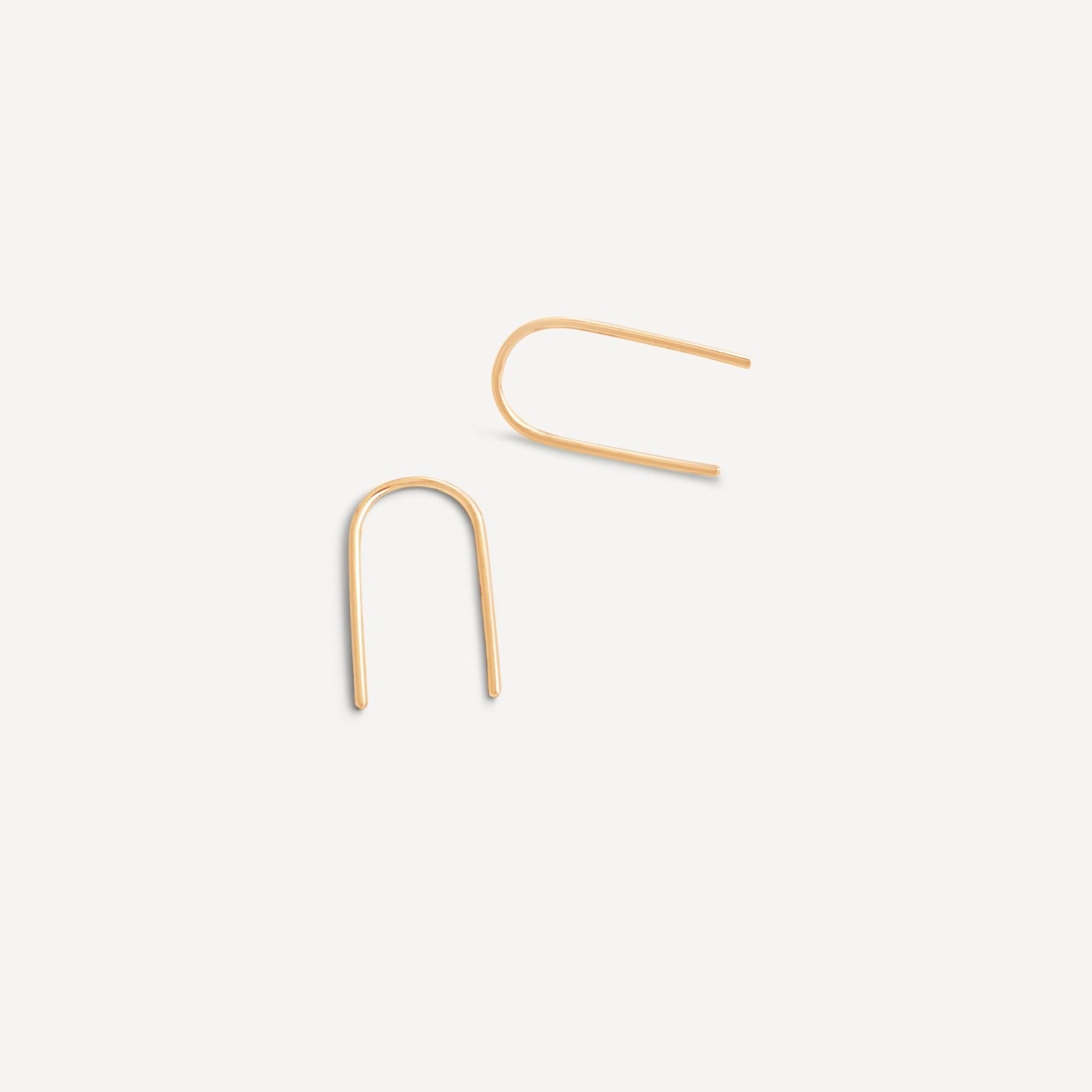 Minimalist Esme Arch Threader Earrings in 14k gold fill, displayed on a neutral background.