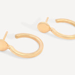 Pair of Forma Circle Hoops made from recycled 14k solid gold, displayed on a neutral background.