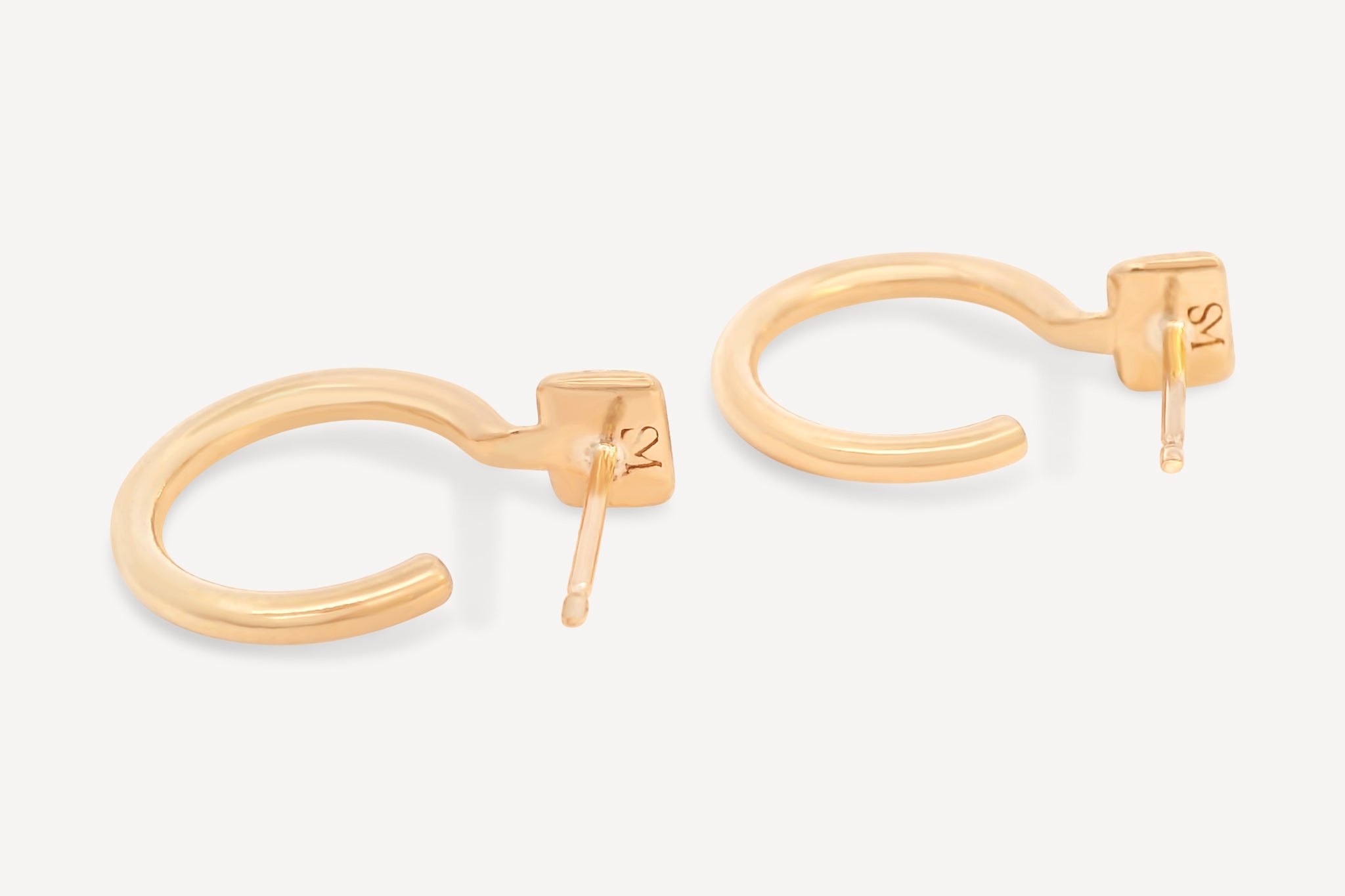 Side view of Forma Rectangle Hoops in 14k solid gold, highlighting their minimalist profile and polished finish.