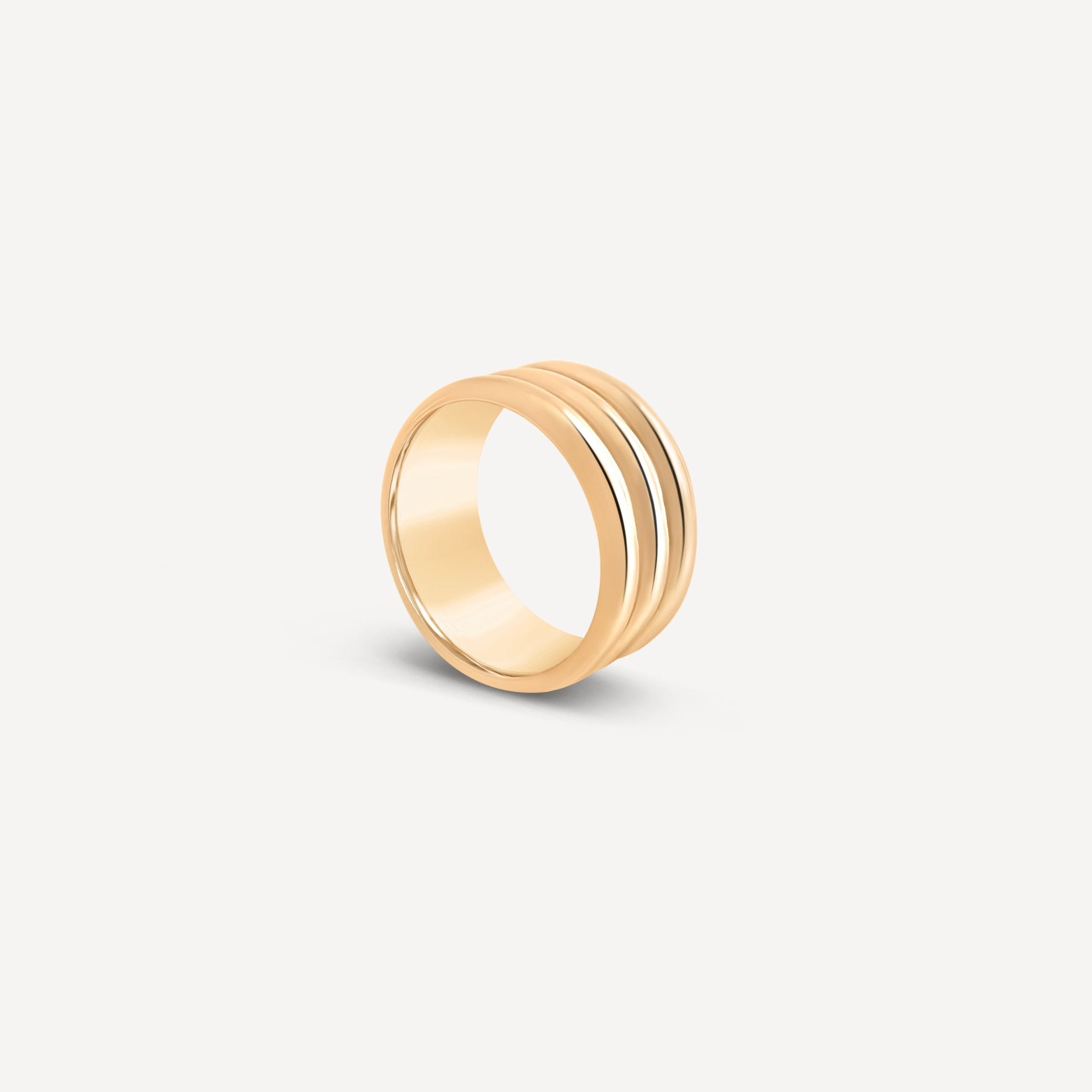 Triple Band Ring in solid gold, featuring a sleek stacked design on a white background.