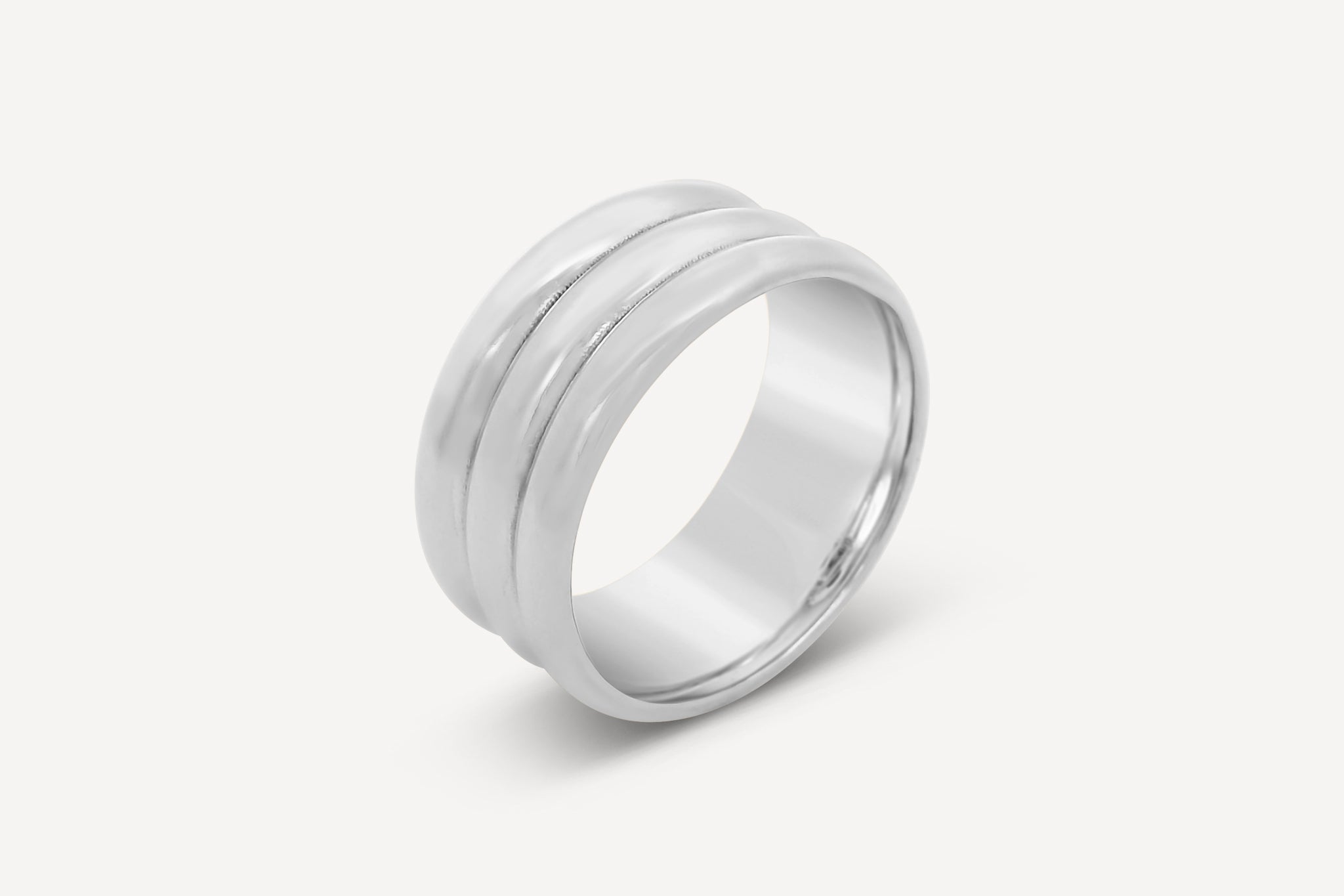 Forma Triple Band Ring in sterling silver featuring a sleek stacked design on a white background.