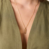 forma triangle knife edge gold pendant on model rounded box chain 14k gold