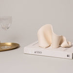 Furl Art Object, Bone styled with a book and tray