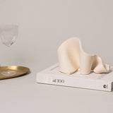 Furl Art Object, Bone styled with a book and tray