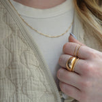 Hammered Ring in gold fill displayed alongside other rings, showcasing its versatility for stacking.