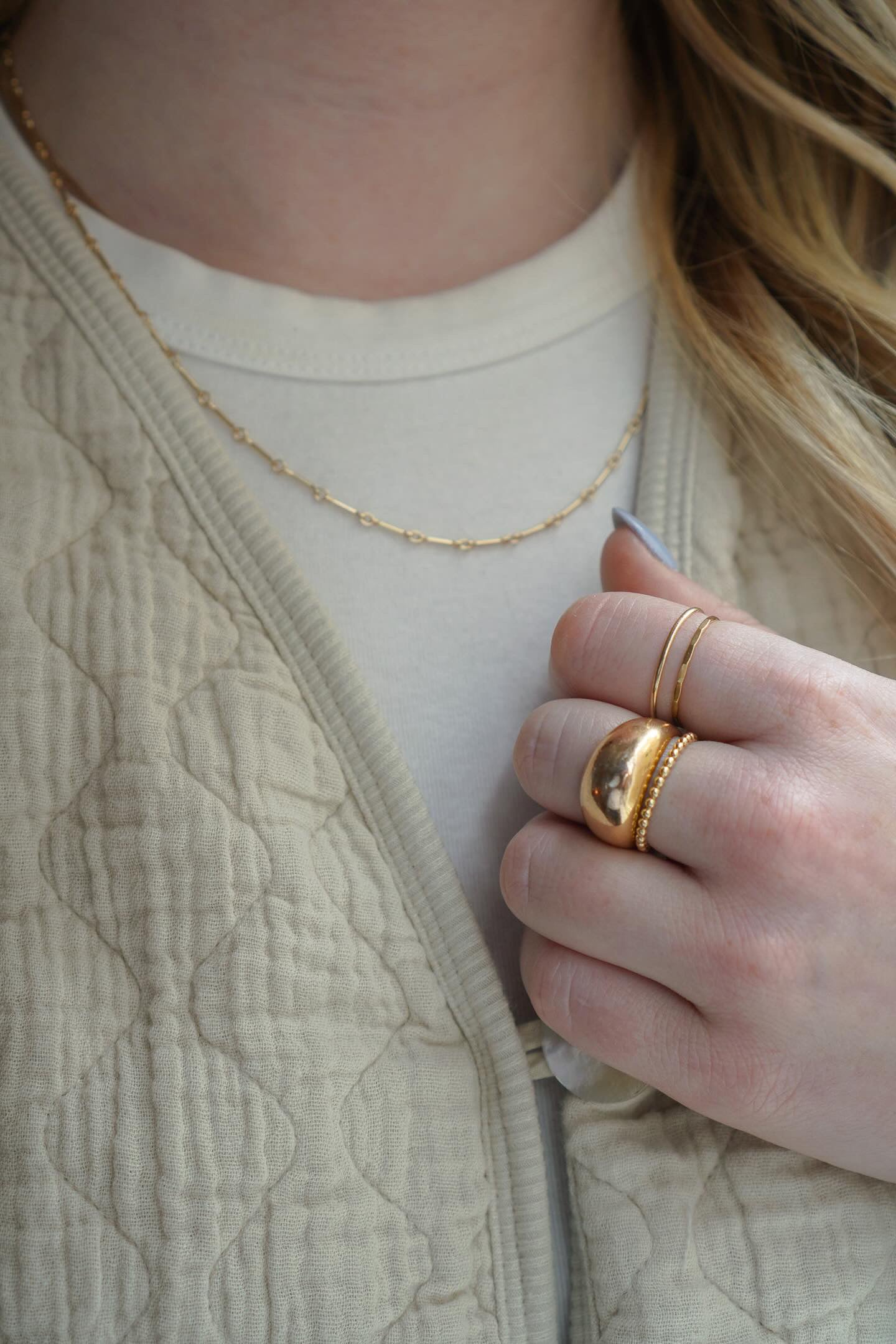 Hammered Ring in gold fill displayed alongside other rings, showcasing its versatility for stacking.