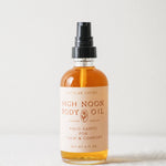 High Noon Body Oil, Palo Santo: Travel Size 2 fl oz — bottle close-up