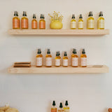 High Noon Body Oil, Palo Santo: Travel Size 2 fl oz displayed with other body oils