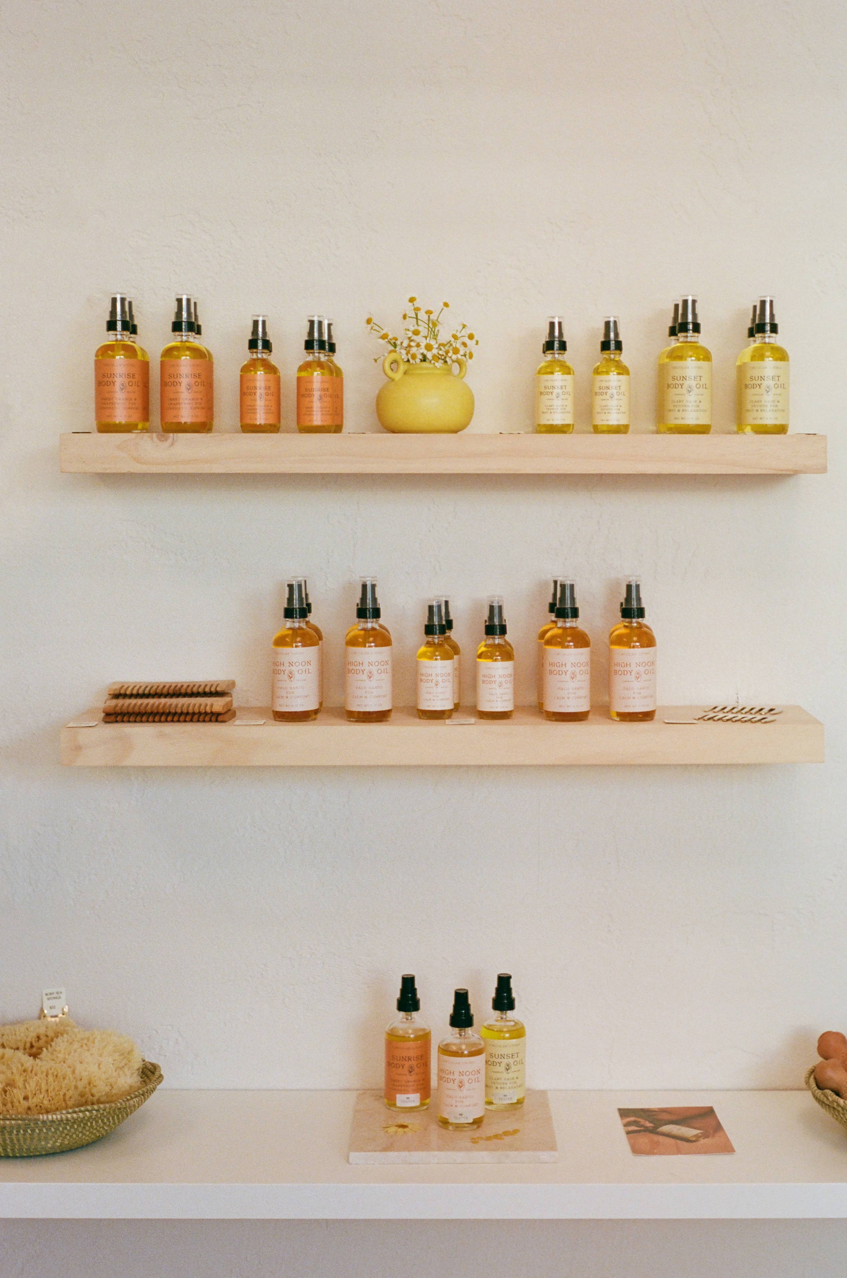 High Noon Body Oil, Palo Santo: Travel Size 2 fl oz displayed with other body oils