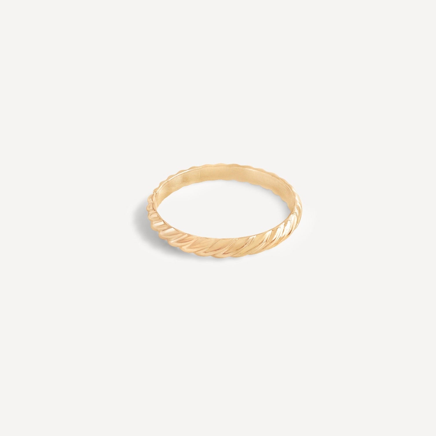 Iris Ring in gold fill featuring a timeless twist design, displayed on a white background.