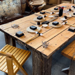 A workspace with jewelry-making tools and materials arranged neatly on a desk.