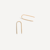 June Arch Earrings in gold fill, showcasing their elegant, hand-formed arch shape on a white background.