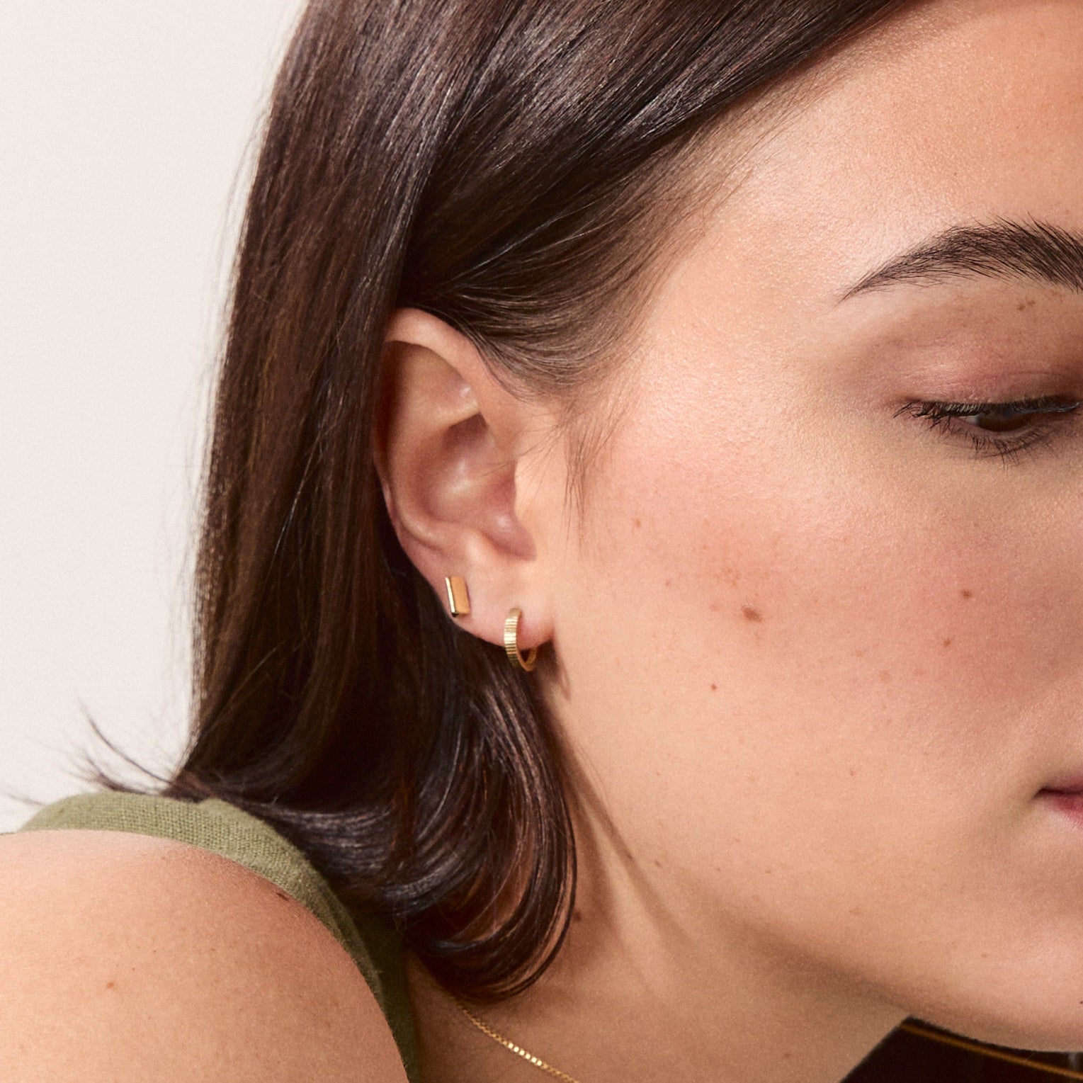 Knife Edge Studs, Solid Gold worn on a model