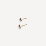 Close-up of the Lily Dot Bar Studs in gold fill, showcasing their delicate dot design and sleek finish.