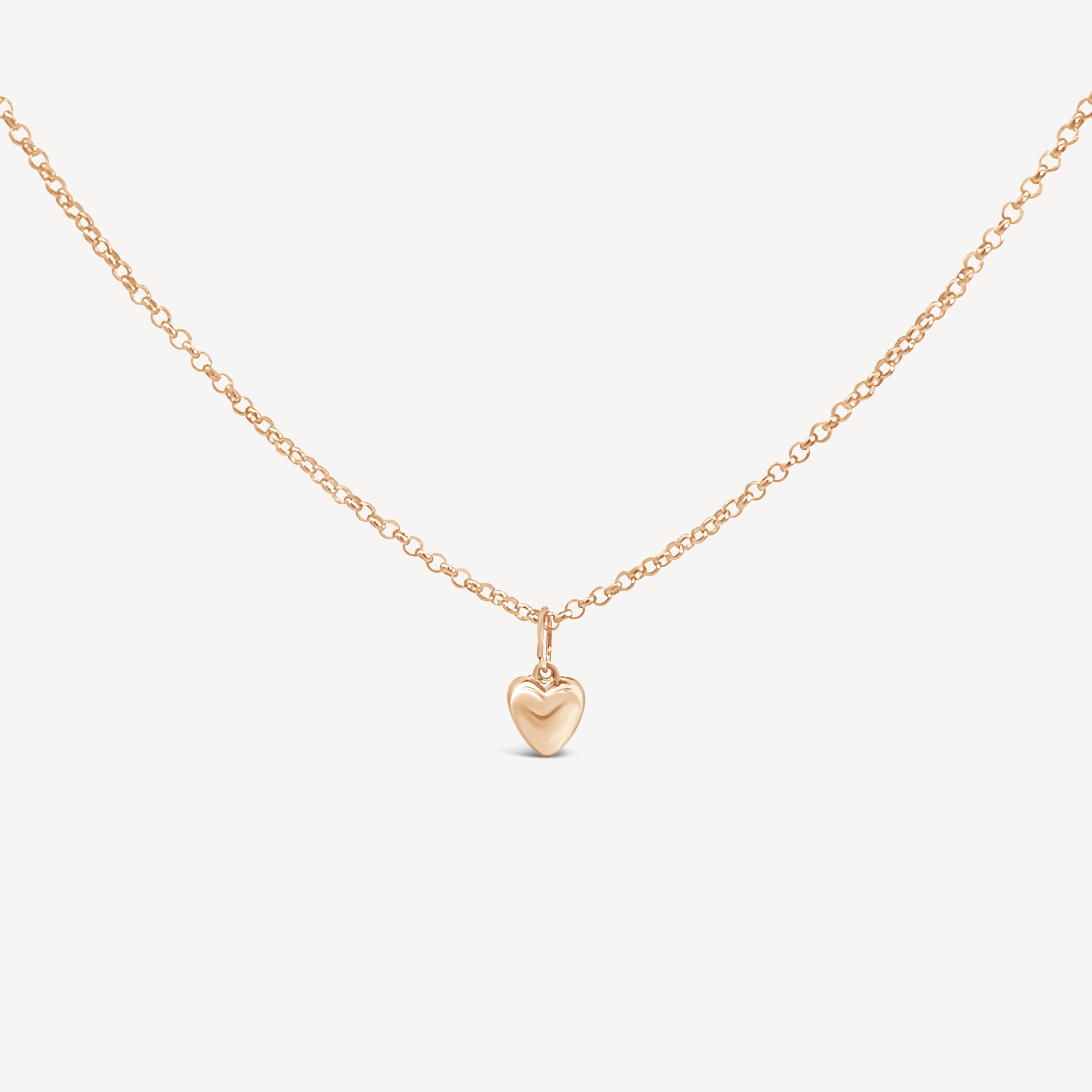 Lou Puff Heart Necklace in gold fill, showcasing the softly puffed heart pendant on a delicate chain.