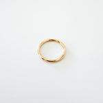 Louise 2mm Round Stacking Ring in 14k gold fill, close-up view showing the smooth round band design.