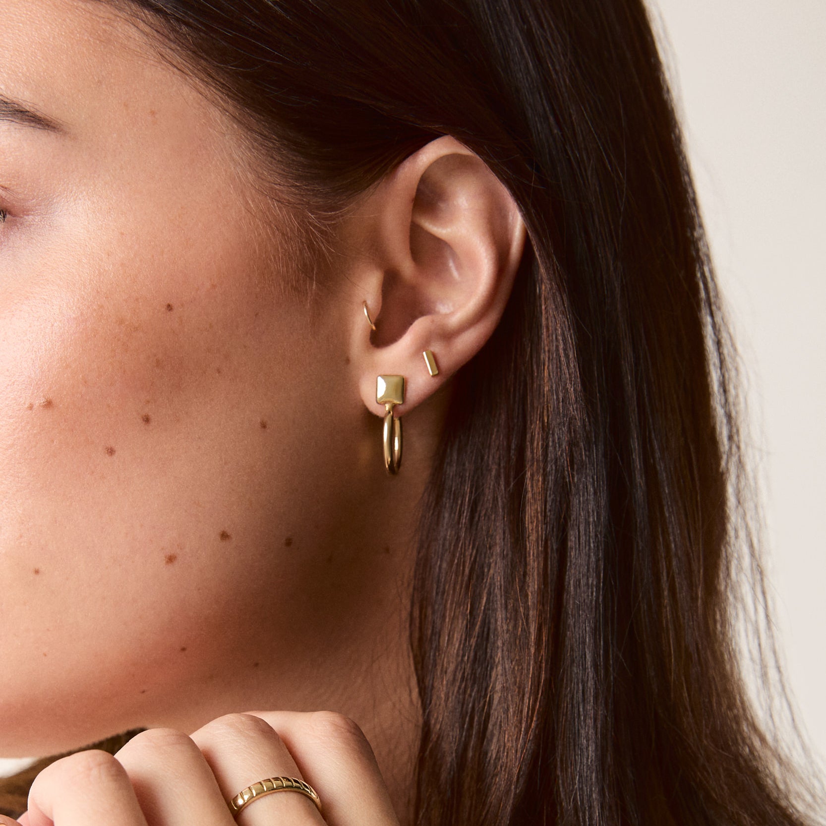 Brass Notch Band worn on a model, showcasing its sleek design and modern edge.