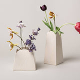 Olto Vase Short, Glacé displayed with a taller vase and flowers