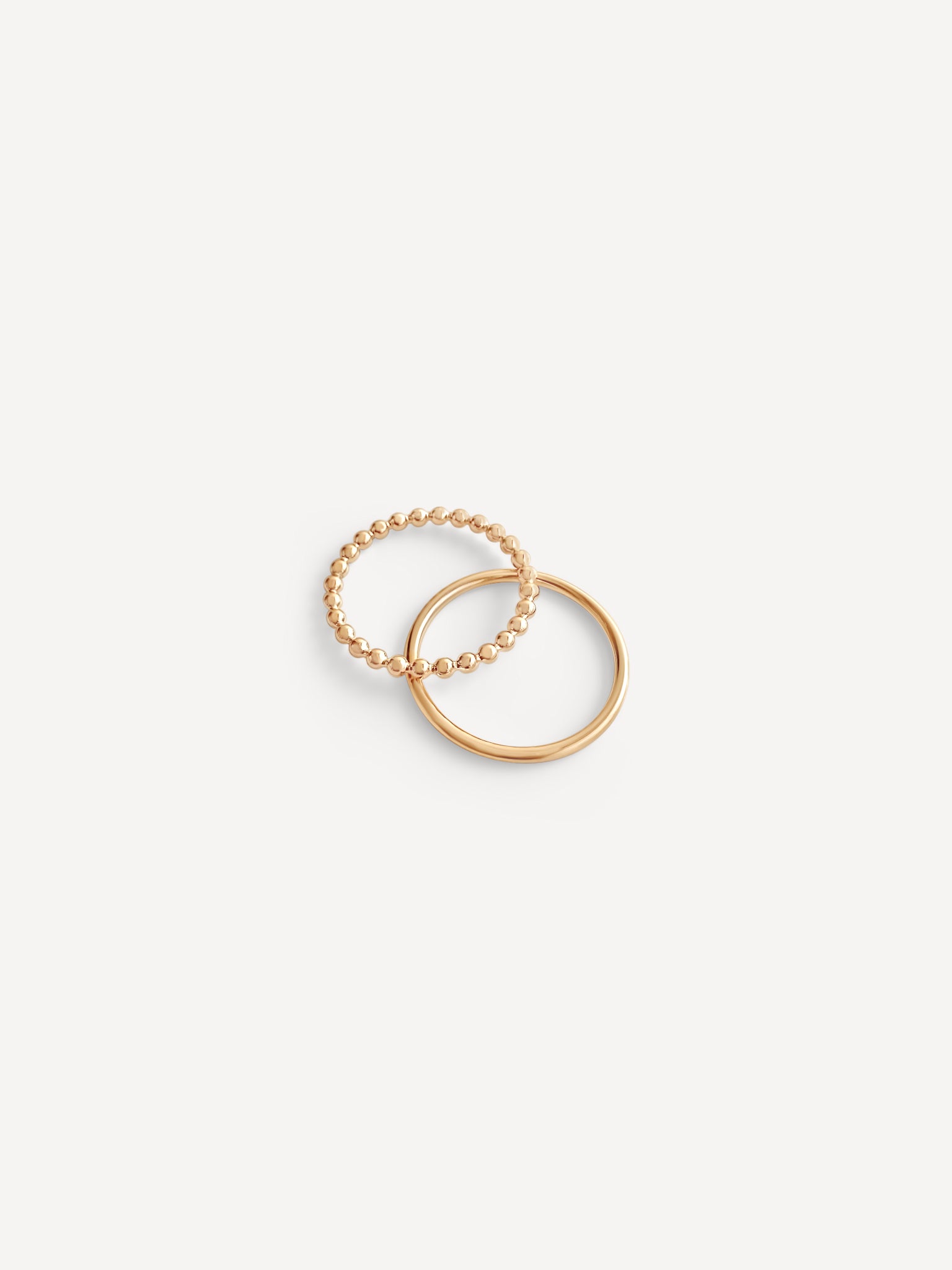 Ophelia Dot Ring crafted in Denver, Colorado, shown stacked with other rings for a timeless and personalized jewelry collection.