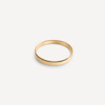 Close-up of Pia Petite Flat Band in 14k gold fill, highlighting its sleek flat design and polished finish.