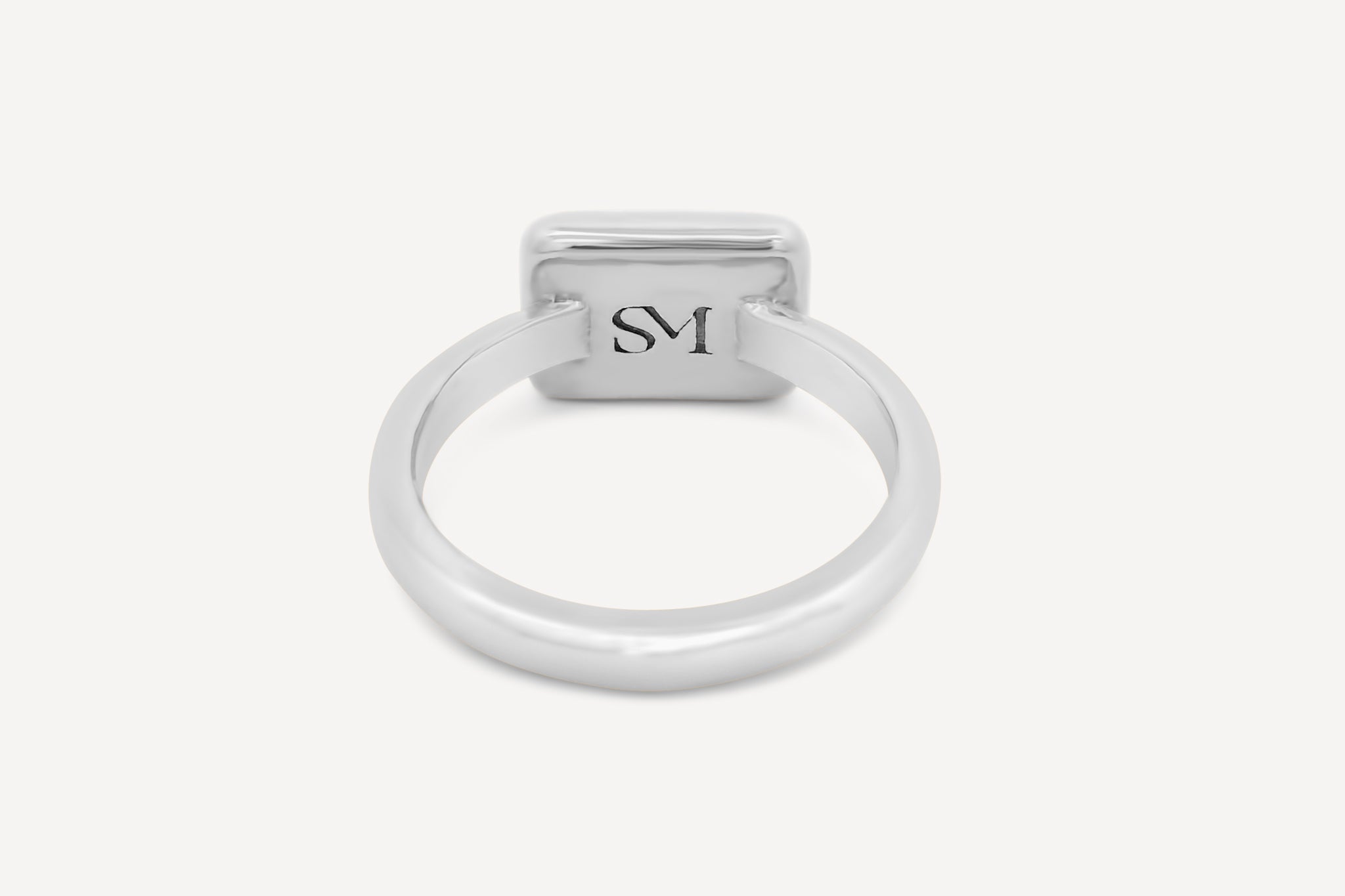 Close-up of the interior of the sterling silver rectangle ring, featuring the stamped SM logo for added detail