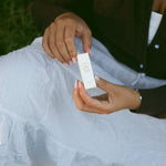 Rose Tallow Lip Balm held in two hands