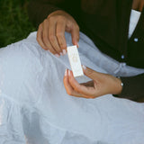 Rose Tallow Lip Balm held in two hands
