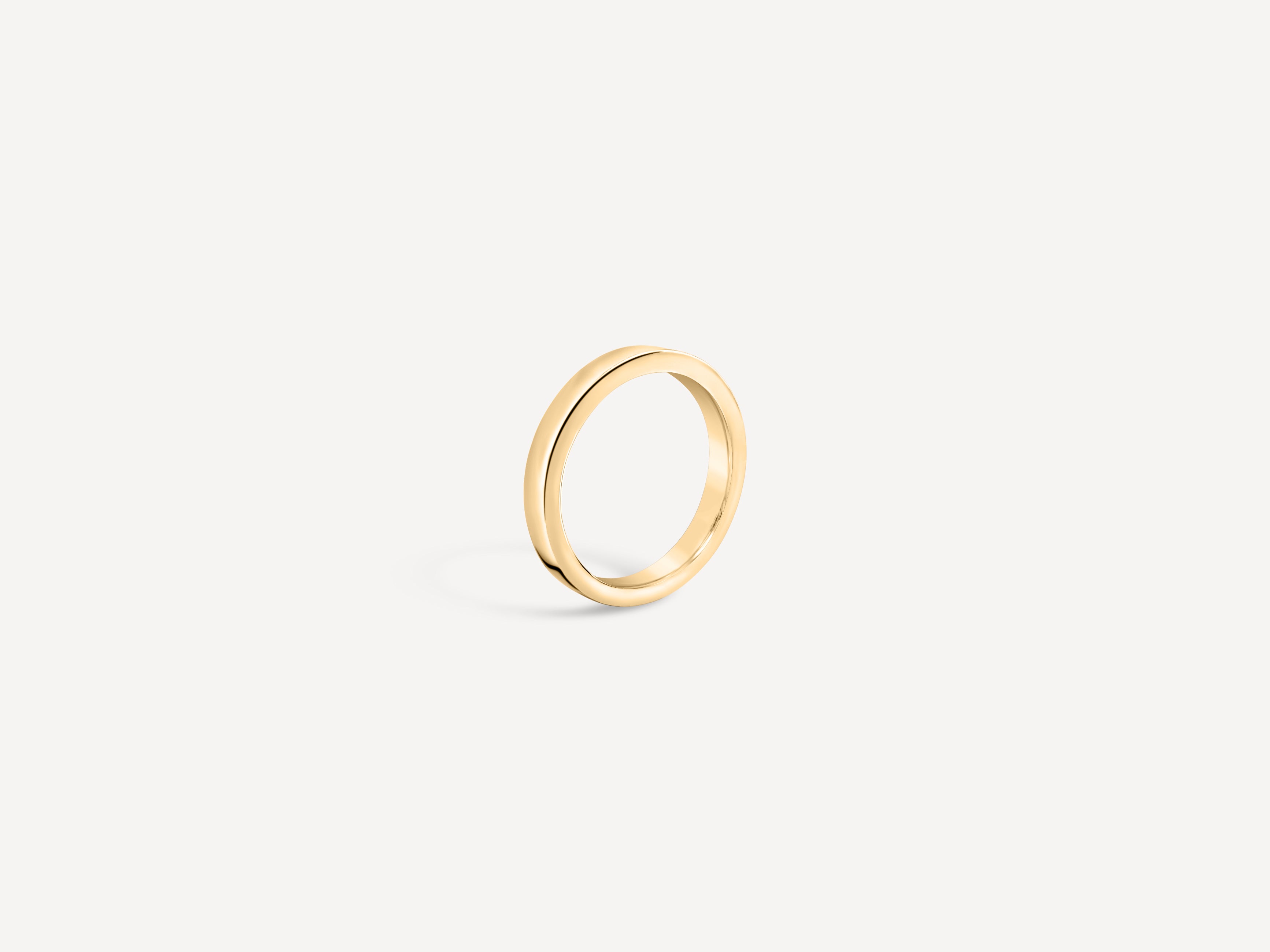 Side view of the solid gold everyday band, showcasing its sleek and modern profile.