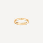 Solid gold everyday band with a smooth, polished finish on a neutral background.