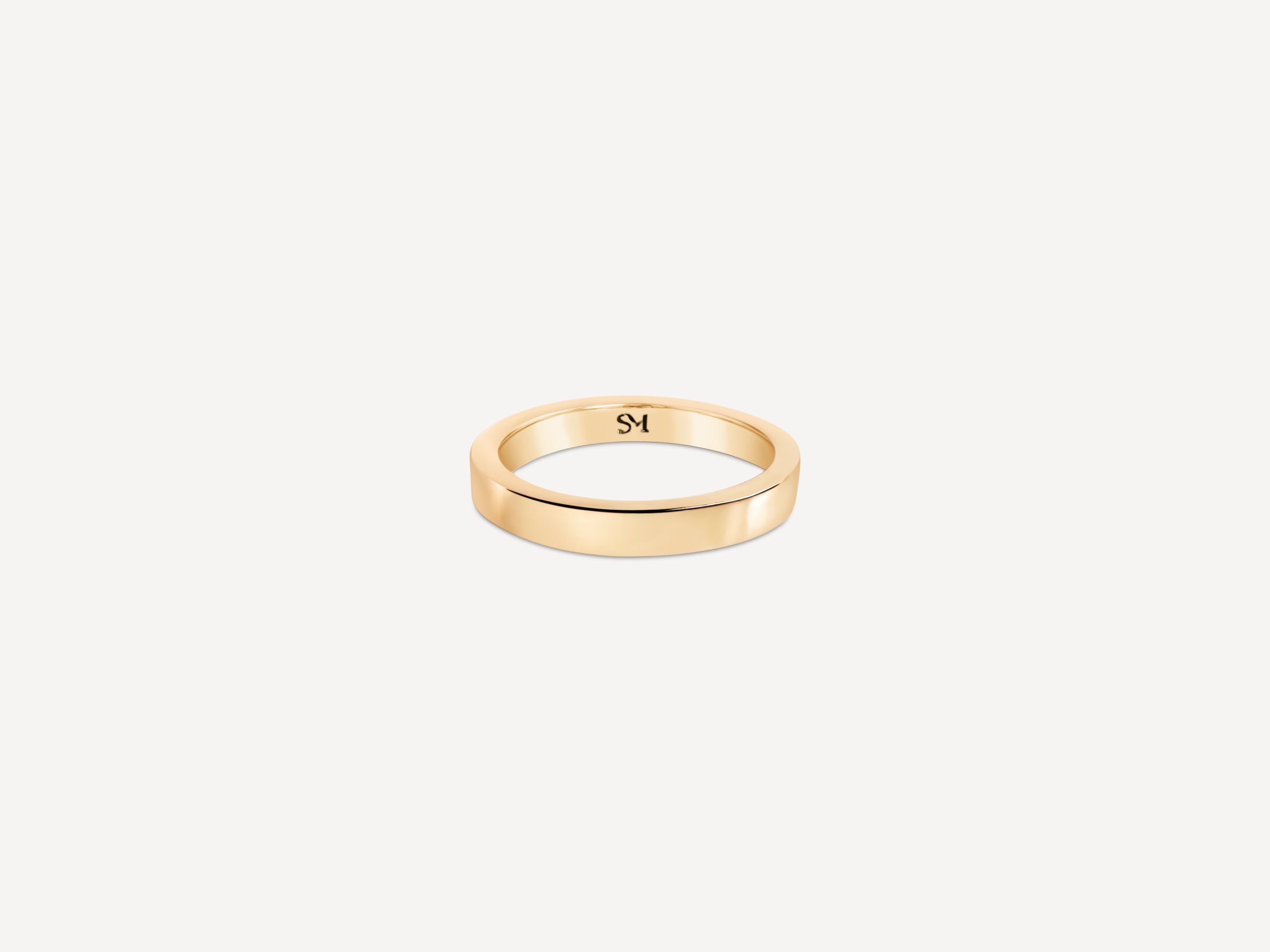 Solid gold everyday band with a smooth, polished finish on a neutral background.